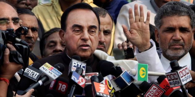 India's opposition lawmaker Subramanian Swamy speaks to the media outside the Supreme Court in New Delhi, India, Thursday, Feb. 2, 2012. India's top court ordered the government on Thursday to cancel 122 cellphone licenses granted to companies during an irregular sale of spectrum that has been branded one of the largest scandals in India's history. Swami filed the court complaint based on which the court canceled the licenses. (AP Photo)
