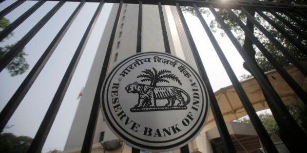 Reserve Bank of India (RBI) logo is displayed on the gate of the RBI headquarters in Mumbai, India, Tuesday, Oct 29, 2013. India's central bank raised its key interest rate for the second time in two months, underlining its determination to control inflation despite concerns economic growth could slow further. (AP Photo/Rafiq Maqbool)