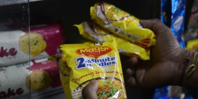 An Indian shopkeeper arranges packets of Nestle 'Maggi' instant noodles from the shelves in his shop in Siliguri on June 5, 2015. India's food safety regulator on June 5 banned the sale and production of Nestle's Maggi instant noodles over a health scare after tests found they contained excessive lead levels. AFP PHOTO/Diptendu DUTTA (Photo credit should read DIPTENDU DUTTA/AFP/Getty Images)