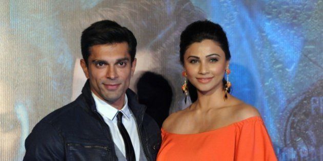 Indian Bollywood actors Karan Singh Grover and Daisy Shah pose during the trailer launch of the upcoming Hindi film 'Hate Story 3' directed by Vishal Pandya in Mumbai on October 16, 2015. AFP PHOTO (Photo credit should read STR/AFP/Getty Images)