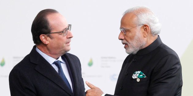 PARIS, FRANCE - NOVEMBER 30: French President Francois Hollande (L) shakes hands with Indian Prime Minister Narendra Modi (R) as he arrives for the COP21 United Nations Climate Change Conference on November 30, 2015 in Le Bourget, France. More than 150 world leaders are meeting for the 21st Session of the Conference of the Parties to the United Nations Framework Convention on Climate Change (COP21/CMP11), from November 30 to December 11, 2015 (Photo by Chesnot/Getty Images)