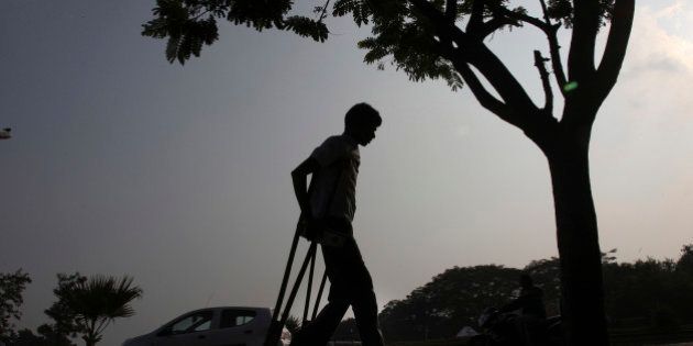 A physically disabled man returns after participating in a walk to mark the International Day of persons with Disabilities in Hyderabad, India, Tuesday, Dec. 3, 2013. According to the United Nations, over one billion people, or approximately 15 per cent of the worldâs population, live with some form of disability. (AP Photo/Mahesh Kumar A.)