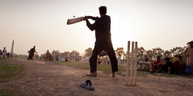 Cricket fans play in teams in Iqbal Park, Lahore, Pakistan, 27th March 2011. (Photo by Christopher Pillitz/GettyImages)