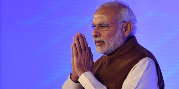 NEW DELHI, INDIA - DECEMBER 4: (Editors Note: This is an exclusive shoot of Hindustan Times) Prime Minister Narendra Modi greets the people during the inaugural address at Hindustan Times Leadership Summit on December 4, 2015 in New Delhi, India. (Photo by Dinesh Krishnan/Hindustan Times via Getty Images)