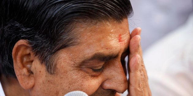 Congress party leader Jagdish Tytler reacts as he holds a press conference to announce his decision to not contest in the upcoming elections in New Delhi, India, Thursday, April 9, 2009. There have been huge protests from the Sikh community and the Home Minister Palaniappan Chidambaram was recently thrown a shoe by a Sikh journalist after Congress party fielded Tytler and Sajjan Kumar as candidates, who are allegedly believed to have instigated mobs to riot against the Sikh community, after the death of former Indian Prime Minister Indira Gandhi. (AP Photo/Saurabh Das)