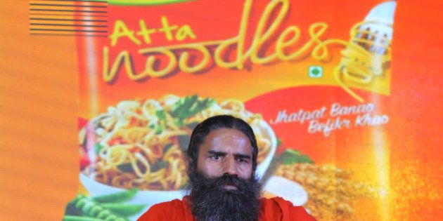 NEW DELHI, INDIA NOVEMBER 16: Baba Ramdev launching Patanjali Atta Noodles on November 16, 2015 in New Delhi, India. Baba Ramdev-promoted Patanjali launched its whole wheat instant noodles, just a week after product leader Nestle's Maggi re-hit the retail shelves after a five-month ban imposed by the food-safety regulator.(Photo by Vipin Kumar/Hindustan Times via Getty Images)