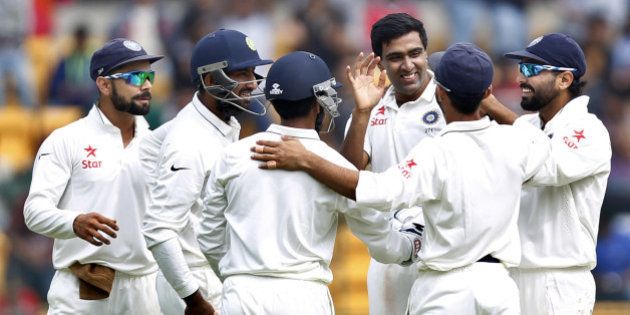 BENGALURU, INDIA - NOVEMBER 14: Indian cricket team player Ravichandran Ashwin and captain Virat Kohli celebrate the dismissal of South African player Stiaan van Zyl during the 2nd Test match between India and South Africa at M. Chinnaswamy Stadium on November 14, 2015 in Bengaluru, India. (Photo by Ajay Aggarwal/Hindustan Times via Getty Images)