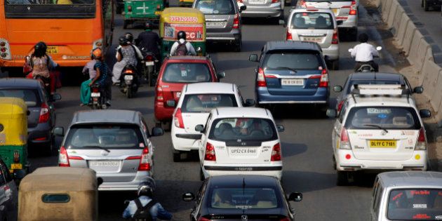 Traffic moves along a highway during morning rush hour in Delhi, India, on Oct 29, 2015. India in October was the last major nation to submit its approach to tackling emissions ahead of a landmark UN climate change conference in December, pledging to cut their intensity about a third by 2030 from 2005 levels. Photographer: Kuni Takahashi/Bloomberg via Getty Images