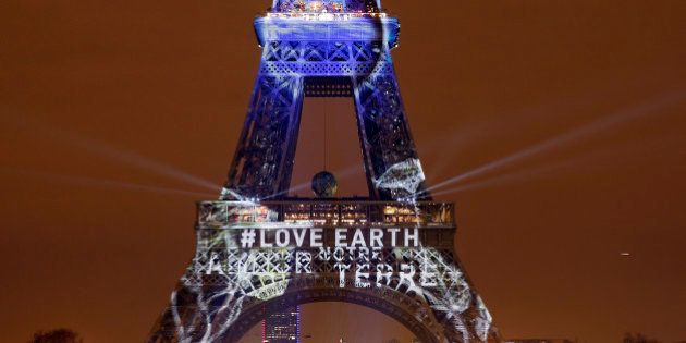PARIS, FRANCE - NOVEMBER 29: An artwork entitled 'One Heart One Tree' by artist Naziha Mestaoui is displayed on the Eiffel tower in the lead up to the Conference on Climate Change COP21 on November 29 in Paris, France. The climate change conference COP21 will gather 193 countries in Paris from November 30 to December 11, 2015. (Photo by Chesnot/Getty Images)