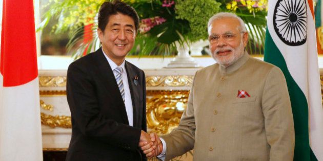 India's Prime Minister Narendra Modi, right, and Japan's Prime Minister Shinzo Abe shake hands before their talks at the state guest house in Tokyo Monday, Sept. 1, 2014. (AP Photo/Toru Hanai, Pool)