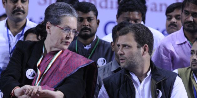 NEW DELHI, INDIA - NOVEMBER 19: Congress President Sonia Gandhi talking with Congress Vice President Rahul Gandhi during a convention of the Indian Youth Congress here to mark the 98th birth anniversary of former prime minister Indira Gandhi at Jawaharlal Nehru Stadium on November 19, 2015 in New Delhi, India. Congress president Sonia Gandhi and her son and party vice president Rahul Gandhi hit out at the government as well as the BJP and RSS accusing the Modi government of pursuing communal and divisive politics.( Photo by Sonu Mehta/Hindustan Times via Getty Images)