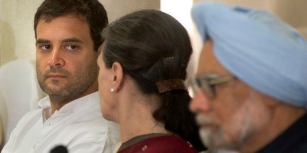 Indiaâs outgoing prime minister Manmohan Singh, sits on the right as Congress party president Sonia Gandhi, center, talks to her son and party vice president Rahul Gandhi, left, during a meeting of the Congress Working Committee to review the partyâs defeat in the general elections in New Delhi, India, Monday, May 19, 2014. The long-dominant Congress party was swept from power after the Hindu nationalist Bharatiya Janata Party (BJP) won the most decisive election victory India has seen in three decades. The BJP had won 282 seats and Congress just 44 in the 543-strong Lok Sabha, or lower house of Parliament. (AP Photo/ Manish Swarup)