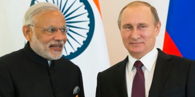 Russian President Vladimir Putin, right, and Indian Prime Minister Narendra Modi pose for photo during a meeting of leaders of BRICS prior the G-20 Summit in Antalya, Turkey, Sunday, Nov. 15, 2015. (AP Photo/Alexander Zemlianichenko)