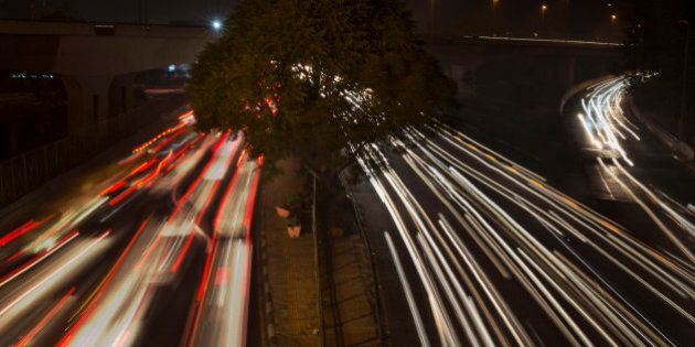 In this Dec 1, 2015 photo, streaks of light show traffic moving in New Delhi, India. Over the last decade the city's air pollution has grown so rapidly that the cold weather turns the city into a grey, smog-filled health nightmare. New Delhi has earned the dubious distinction of being the world's dirtiest city, surpassing Beijing, once the poster child for air pollution. (AP Photo /Tsering Topgyal)