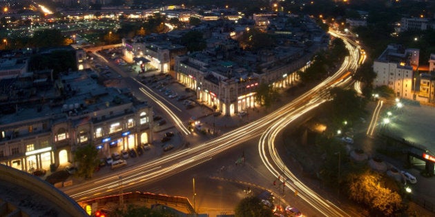 This photograph taken on April 18, 2013 shows the Indian capital's skyline as traffic drives around the outer circle of Connaught Place in the heart of New Delhi. AFP PHOTO/ MANAN VATSYAYANA (Photo credit should read MANAN VATSYAYANA/AFP/Getty Images)