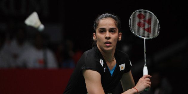 JAKARTA, INDONESIA - AUGUST 16: Saina Nehwal of India competes against Carolina Marin of Spain in the women singles final match of the 2015 Total BWF World Championship at Istora Senayan on August 16, 2015 in Jakarta, Indonesia. (Photo by Robertus Pudyanto/Getty Images)