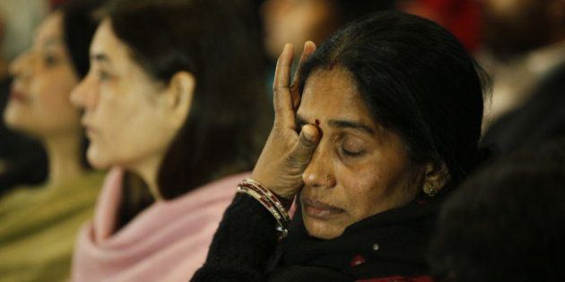 NEW DELHI, INDIA - DECEMBER 16: Mother of Nirbhaya gets emotional at a prayer meeting to remember Nirbhaya on the second anniversary of the fatal gang-rape organized by Nirbhaya Jyoti Trust at Rajendra Bhawan on December 16, 2014 in New Delhi, India. On December 16, 2012, a 23-year-old physiotherapy student was brutally gang raped and by six men, including a juvenile, in a moving bus. The incident unleashed a wave of public anger over levels of violence against women in the country. Nirbhaya Jyoti Trust which was established by Nirbhayas parents (Photo by Raj K Raj/Hindustan Times via Getty Images)