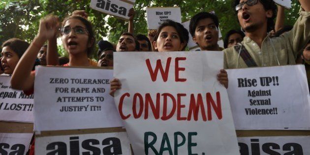Indian students shout slogans during a protest against the rapes of two minor girls outside the police headquarters in New Delhi on October 18, 2015. Indian police said October 17 they have arrested two teenagers over the rape of a two-year-old girl, who was found bleeding in a park near her New Delhi home on the night of October 16. AFP PHOTO / SAJJAD HUSSAIN (Photo credit should read SAJJAD HUSSAIN/AFP/Getty Images)