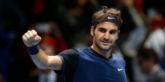 Roger Federer of Switzerland celebrates after defeating Kei Nishikori of Japan after their singles tennis match at the ATP World Tour Finals at the O2 Arena in London, Thursday, Nov. 19, 2015. (AP Photo/Alastair Grant)