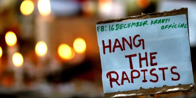 NEW DELHI, INDIA - DECEMBER 16: A placard calling for capital punishment for rapists is pictured beside a memorial at the protestors corner in Jantar Mantar on the second anniversary of the fatal gang-rape of a student on December 16, 2014 in New Delhi, India. On December 16, 2012, a 23-year-old physiotherapy student was brutally gang raped and by six men, including a juvenile, in a moving bus. The incident unleashed a wave of public anger over levels of violence against women in the country. (Photo by Arun Sharma/Hindustan Times via Getty Images)