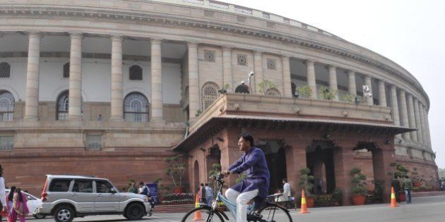 NEW DELHI, INDIA - DECEMBER 7: BJP Rajya Sabha MP Mansukh L Mandaviya arrives on his cycle at Parliament during the winter session on December 7, 2015 in New Delhi, India. The third week of the winter session of Parliament is likely to see the NDA government push for passage of key legislation including the GST Bill. (Photo by Mohd Zakir/Hindustan Times via Getty Images)