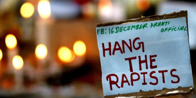 NEW DELHI, INDIA - DECEMBER 16: A placard calling for capital punishment for rapists is pictured beside a memorial at the protestors corner in Jantar Mantar on the second anniversary of the fatal gang-rape of a student on December 16, 2014 in New Delhi, India. On December 16, 2012, a 23-year-old physiotherapy student was brutally gang raped and by six men, including a juvenile, in a moving bus. The incident unleashed a wave of public anger over levels of violence against women in the country. (Photo by Arun Sharma/Hindustan Times via Getty Images)
