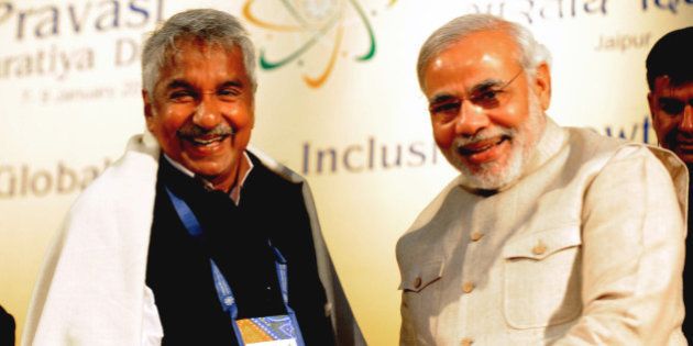 Gujarat Chief minister Narendra Modi (R) shakes hands with Kerala Chief Minister Oommen Chandy during the 10th Pravasi Bharatiya Divas 2012 (Overseas Indian Conference) in Jaipur on January 9, 2012. Some 1.600 delegates from 50 countries attend the annual gathering of overseas Indian where Trinidad and Tobago Prime Minister Kamala Persd Bissessar is present as the chief guest. AFP PHOTO/ RAVEENDRAN (Photo credit should read RAVEENDRAN/AFP/Getty Images)
