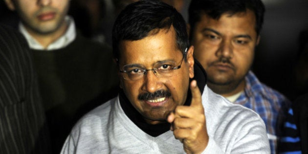 NEW DELHI, INDIA - DECEMBER 15: Delhi Chief Minister Arvind Kejriwal talking with media person outside the residence of Deputy Chief Minister Manish Sisodia on CBI raid on office of his Principal Secretary on December 15, 2015 in New Delhi, India. Enraged over this issue, Kejriwal claimed that his office was raided by CBI team allegedly on the orders of Prime Minister Narendra Modi. The central government rejected saying that it has no role to play in the raid. CBI investigators searched the office of Rajendra Kumar, Principal Secretary to the Delhi government, situated near Kejriwal's office in connection with corruption case. (Photo by Sonu Mehta/Hindustan Times via Getty Images)