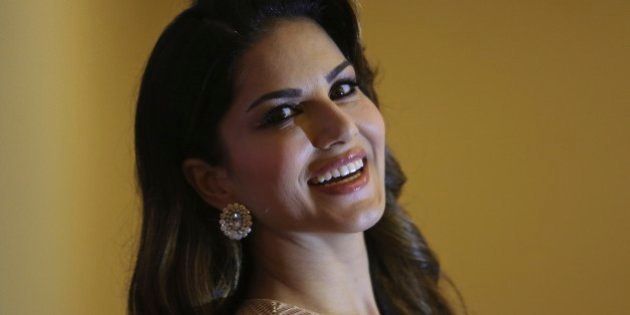 Bollywood star Sunny Leone poses after a press conference to promote her upcoming movie