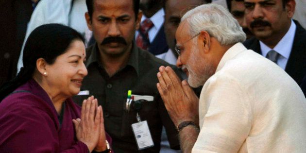 Tamil Nadu state Chief Minister J. Jayalalithaa, left, greets Bharatiya Janata Party (BJP) leader Narendra Modi before the oath taking ceremony, in Ahmadabad, India, Wednesday, Dec. 26, 2012. Hindu nationalist leader Narendra Modi won a resounding victory in state elections was sworn in Wednesday for a fourth term as chief minister in the western Indian state of Gujarat. (AP Photo/Ajit Solanki)