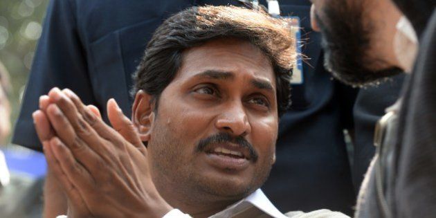 YSR Congress chief, Jagan Mohan Reddy gestures during a protest against the bifurcation of Andhra Pradesh, in New Delhi on February 17, 2104. YSR Congress, which is stiffly opposing the bifurcation of Andhra Pradesh, sought Left support for stalling the creation of Telangana state and asking all opposition parties to oppose its creation. AFP PHOTO/ SAJJAD HUSSAIN (Photo credit should read SAJJAD HUSSAIN/AFP/Getty Images)