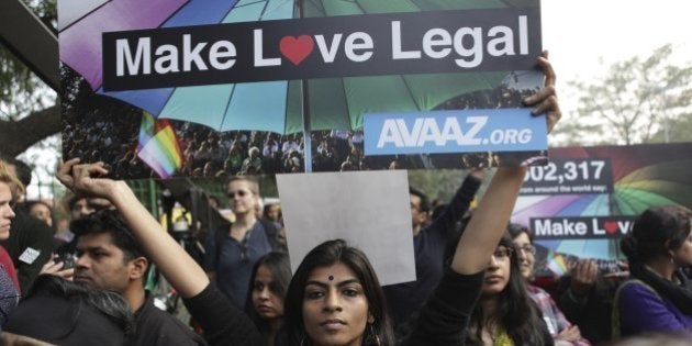 Indian gay rights activists hold placards during a protest against a Supreme Court verdict that upheld section 377 of the Indian Penal Code that criminalizes homosexuality in New Delhi, India, Sunday, Dec. 15, 2013. Hundreds of gay rights activists gathered in India's capital and other cities across the country on Sunday to protest a decision by India's top court to uphold a law that criminalizes gay sex. (AP Photo/Tsering Topgyal)