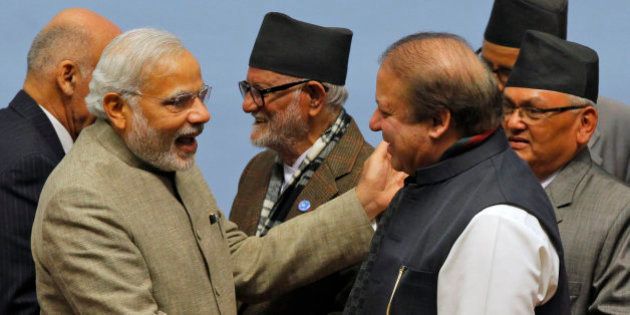 Pakistani Prime Minister Nawaz Sharif, right, and Indian Prime Minister Narendra Modi shake hands during the closing session of the 18th summit of the South Asian Association for Regional Cooperation (SAARC) in Katmandu, Nepal, Thursday, Nov. 27, 2014. South Asian heads of state attending their first summit in three years reached a deal on energy sharing Thursday, but failed on two other economic agreements during a retreat where Indian and Pakistan leaders shook hands. (AP Photo/Niranjan Shrestha, Pool)