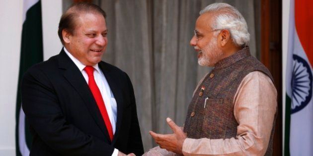 Indian Prime Minister Narendra Modi, right, shakes hand with his Pakistani counterpart Nawaz Sharif before the start of their meeting in New Delhi, India, Tuesday, May 27, 2014. Analysts say Sharif's visit could signal an easing of tensions between the often-hostile, nuclear-armed neighbors. No details were given about what the two men would discuss, but Modi is likely to ask Pakistan to hasten investigations into the Mumbai attack and put its perpetrators on trial. (AP Photo/Saurabh Das)