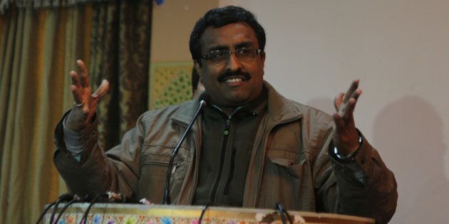 SRINAGAR, INDIA - NOVEMBER 27: Bharatiya Janata Party (BJP) National General Secretary Ram Madhav addresses the audience during a function on November 27, 2014 in Srinagar, India. RSS ideologue Ram Madhav said the BJP would form the government in the state on its own. He said that the party would accomplish Mission 44 in the state. So far, BJP has released names of 72 candidates, 20 of whom are Muslims. (Photo by Waseem Andrabi/ Hindustan Times via Getty Images)