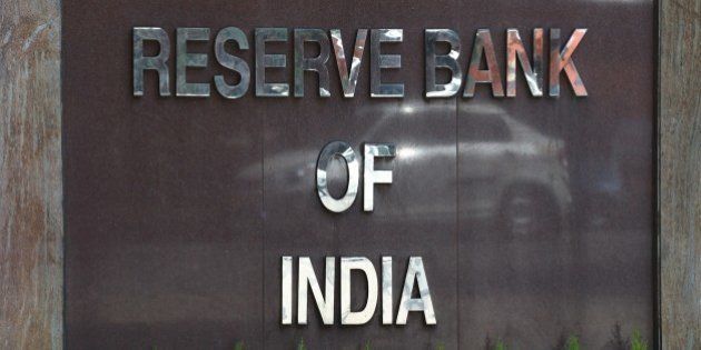 A car is reflected in the signage of the Reserve Bank of India (RBI) sign during a meeting by Indian finance minister Arun Jaitley with the Central Board of Directors of the Reserve Bank of India in New Delhi on March 22, 2015. Finance MinisterÂ Arun JaitleyÂ said there is no 'disconnect' between the government and the RBI and hoped banks would follow the central bank in reducing interest rates.Â AFP PHOTO / SAJJAD HUSSAIN (Photo credit should read SAJJAD HUSSAIN/AFP/Getty Images)