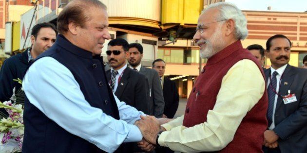 LAHORE, PAKISTAN - DECEMBER 25: Prime Minister of Pakistan Nawaz Sharif (L) shakes hands with Indian Prime Minister Narendra Modi (R) at Allama Iqbal International Airport in Lahore, Pakistan on December 25, 2015. (Photo by Indian Press Information office/Anadolu Agency/Getty Images)