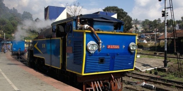 The Nilgiri Queen meter gauge cog-drive steam locomotive has pulled us from Mettupalayam to Conoor along the Nilgiri Mountain Railway. Here, in the Conoor station, she has been detached to be replaced by a diesel locomotive for the final leg up to Ooty.