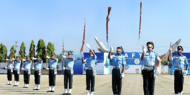 The Air Warrior Drill Team of the Indian Air Force perform a routine during a passing out parade of Aeronautical Engineers at The Air Force Technical College in Bangalore on December 4, 2015. The Parade marks the culmination of 74 weeks of training in Aeronautical Engineering, Military Leadership, Managerial Skills and Ethos of an air warrior. The passing out batch comprised 136 officers, including 37 women and 11 international officers. AFP PHOTO/Manjunath KIRAN / AFP / MANJUNATH KIRAN (Photo credit should read MANJUNATH KIRAN/AFP/Getty Images)