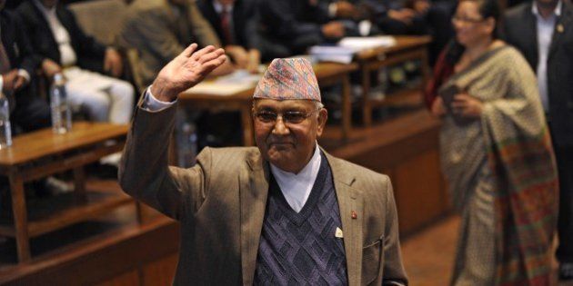 Nepal's Prime Minister KP Sharma Oli waves after casting his vote in an election for Nepal's new president in Kathmandu on October 28, 2015. The legislature was to vote on October 28 for a replacement for Ram Baran Yadav as ceremonial head of state, as required under the new constitution adopted last month. AFP PHOTO / Prakash MATHEMA (Photo credit should read PRAKASH MATHEMA/AFP/Getty Images)