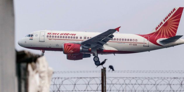 An Airbus SAS A319 aircraft operated by Air India Ltd. approaches to land at Chhatrapati Shivaji International Airport in Mumbai, India, on Monday, Oct. 26, 2015. Air India is the nation's third biggest airline by market share. Photographer: Dhiraj Singh/Bloomberg via Getty Images