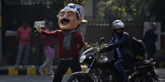 NEW DELHI, INDIA - DECEMBER 30: A dummy of Delhi CM Arvind Kejriwal is seen on the road promoting odd-even campaign on December 30, 2015 at Ferozshah Road in New Delhi, India. The odd-even number plate policy will come to force in Delhi from January 1 till January 15. Delhiites stand divided over the implementation of the odd-even plan, with some supporting the novelty of congestion-free roads while others mocking the impracticality of it. (Photo by Ravi Choudhary/Hindustan Times via Getty Images)