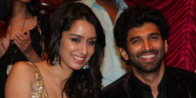 Indian Bollywood actors Shraddha Kapoor (L) and Aditya Roy Kapoor attend a soundtrack launch event for the forthcoming Hindi Film 'Aashiqui 2' in Mumbai on April 8, 2013. AFP PHOTO (Photo credit should read STRDEL/AFP/Getty Images)