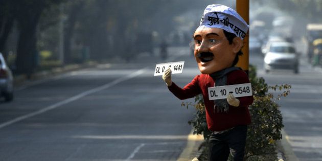 NEW DELHI, INDIA - DECEMBER 30: A dummy of Delhi CM Arvind Kejriwal is seen on the road promoting odd-even campaign on December 30, 2015 at Ferozshah Road in New Delhi, India. The odd-even number plate policy will come to force in Delhi from January 1 till January 15. Delhiites stand divided over the implementation of the odd-even plan, with some supporting the novelty of congestion-free roads while others mocking the impracticality of it. (Photo by Ravi Choudhary/Hindustan Times via Getty Images)