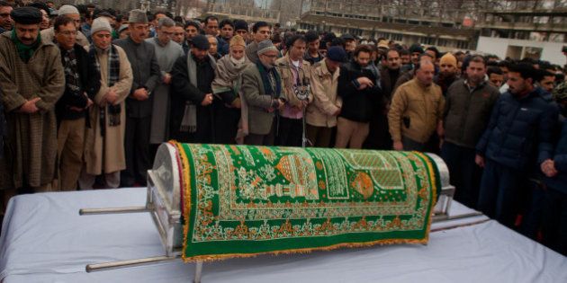 SRINAGAR, KASHMIR, INDIA - JANUARY 07: Pro Indian politician and supporters carry the casket bearing the body of pro Indian Jammu and Kashmir Chief Minister Mufti Mohammad Sayeed during his funeral, on January 07, 2016 in Srinagar, the summer capital of Indian-controlled Kashmir, India. Mufti Mohammad Sayeed, a pro Indian politician of Indian administered Kashmir, served twice as the Chief Minister of strife torn Jammu and Kashmir; for three years from November 2002 till November 2005 and then again from March 2015 until his death in January 2016. Mufti died on Thursday morning at the All India Institute of Medical Sciences in Delhi, where he remained admitted for 14 days. His daughter Mehbooba Mufti is set to take over as Chief Minister . Sayeed was also Home Minister of Indian government from December 1989 to November 1990. He founded the Jammu and Kashmir People's Democratic Party, in July 1999. He died on 7 January 2016 at , Delhi due to multiple organ failure. (Photo by Yawar Nazir/Getty Images)