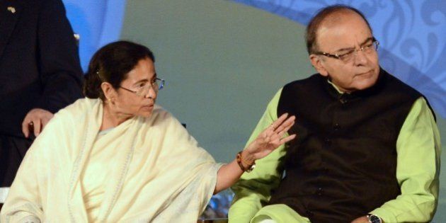 The Chief Minister of the Indian state of West Bengal Mamata Banerjee (L) gestures as Indian Union Finance Minister Arun Jaitley looks on during the start of the Bengal Global Business Summit 2016 in Kolkata on January 8, 2016. Business delegates from more than 25 countries are taking part in the two-day event. AFP PHOTO / DIBYANGSHU SARKAR / AFP / DIBYANGSHU SARKAR (Photo credit should read DIBYANGSHU SARKAR/AFP/Getty Images)