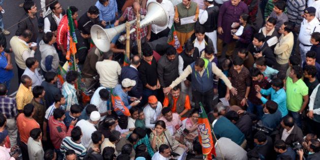 KOLKATA, WEST BENGAL, INDIA - 2016/01/06: BJP State Yuva Morcha organized a half hour roadblock at M.G. Road and C.R. Avenue crossing protesting against Kaliachowk, Malda incident. (Photo by Saikat Paul/Pacific Press/LightRocket via Getty Images)