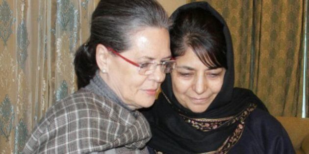 SRINAGAR, INDIA - JANUARY 10: Congress President Sonia Gandhi meets PDP President Mehbooba Mufti to offer condolences on the demise of her father Mufti Mohammad Sayeed on January 10, 2016 in Srinagar, India. Mufti died on Thursday at AIIMS in New Delhi. He had been undergoing treatment there since December 24. (Photo by Waseem Andrabi/Hindustan Times via Getty Images)