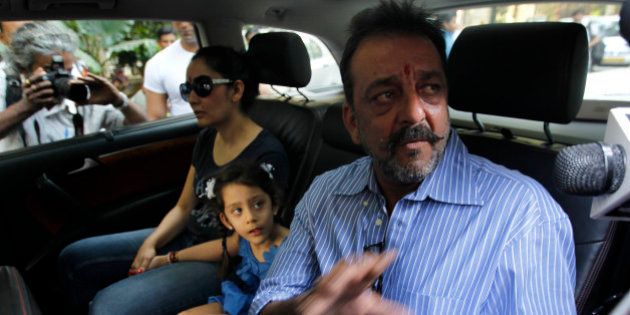 MUMBAI, INDIA - JANUARY 8: Bollywood actor Sanjay Dutt with wife Manyata and kids before leaving for Yerawada Jail to serve the remainder of his term after 14-day-long furlough ended on January 8, 2015 in Mumbai, India. Dutt was convicted for illegal possession and destruction of an AK-56 army assault rifle during the 1993 Mumbai communal conflagration before the March 12, 1993 serial bomb blasts in the city. (Photo by Vijayanand Gupta/Hindustan Times via Getty Images)