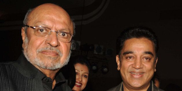 Indian Bollywood directors Shyam Benegal and actor Kamal Haasan attend the opening of the 15th Mumbai Film Festival (MAMI) in Mumbai on October 17, 2013. AFP PHOTO/STR (Photo credit should read STRDEL/AFP/Getty Images)